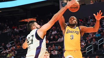 Fardaws Aimaq goes up to try to block a shot by Bronny James