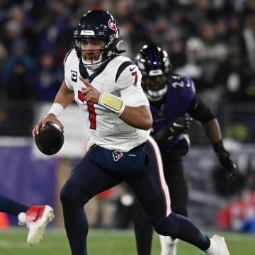 Jan 20, 2024; Baltimore, MD, USA; Houston Texans quarterback C.J. Stroud (7) runs the ball against the Baltimore Ravens during the second quarter of a 2024 AFC divisional round game at M&T Bank Stadium. Mandatory Credit: Tommy Gilligan-USA TODAY Sports
