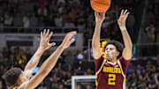Feb 15, 2024; West Lafayette, Indiana, USA; Minnesota Golden Gophers guard Mike Mitchell Jr. (2) attempts a shot over Purdue Boilermakers forward Mason Gillis (0) during the first half at Mackey Arena. Mandatory Credit: Robert Goddin-Imagn Images