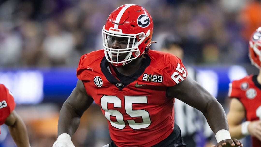 Jan 9, 2023; Inglewood, CA, USA; Georgia Bulldogs offensive lineman Amarius Mims (65) against the TCU Horned Frogs during the CFP national championship game at SoFi Stadium. Mandatory Credit: Mark J. Rebilas-Imagn Images