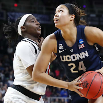 Mar 31, 2019; Albany , NY, USA; UConn Huskies forward Napheesa Collier (24) drives to the basket against Louisville Cardinals forward Bionca Dunham (left) during the second half in the championship game of the Albany regional in the women's 2019 NCAA Tournament at Times Union Center. Mandatory Credit: Rich Barnes-Imagn Images