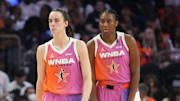 Team WNBA teammates Caitlin Clark (22), center, forward Aliyah Boston (7), right, and center Jonquel Jones (35) take on Team USA during the WNBA All-Star Game at Footprint Center in Phoenix on July 20, 2024.