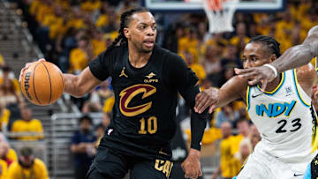 May 9, 2025; Indianapolis, Indiana, USA; Cleveland Cavaliers guard Darius Garland (10) dribbles the ball while Indiana Pacers forward Aaron Nesmith (23) defends during game three of the second round for the 2025 NBA Playoffs at Gainbridge Fieldhouse. Mandatory Credit: Trevor Ruszkowski-Imagn Images