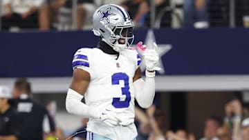 Dallas Cowboys wide receiver George Pickens (3) celebrates after scoring a touchdown in the fourth quarter against the Green Bay Packers at AT&T Stadium.