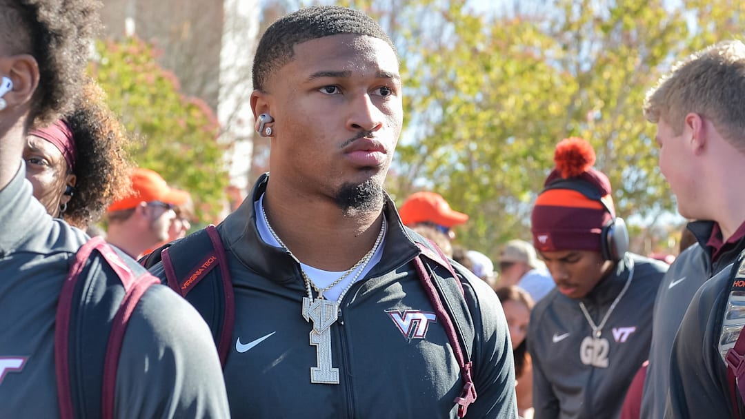 Nov 9, 2024; Blacksburg, Virginia, USA;  Virginia Tech Hokies quarterback Kyron Drones (1) as he walks into the stadium before the game against the Clemson Tigers at Lane Stadium. Mandatory Credit: Brian Bishop-Imagn Images