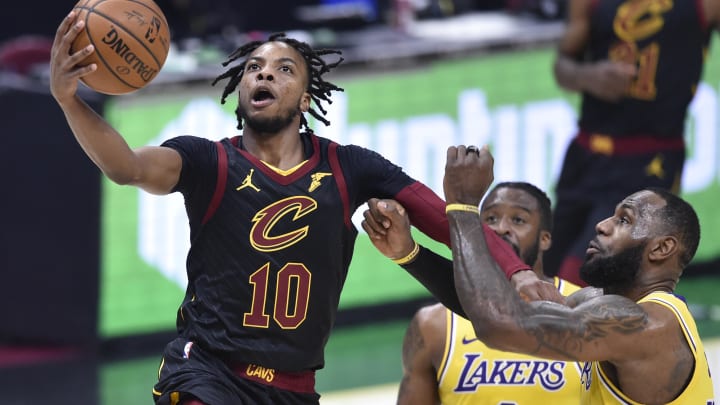 Jan 25, 2021; Cleveland, Ohio, USA; Cleveland Cavaliers guard Darius Garland (10) drives against Los Angeles Lakers forward LeBron James (23) in the second quarter at Rocket Mortgage FieldHouse. Mandatory Credit: David Richard-USA TODAY Sports