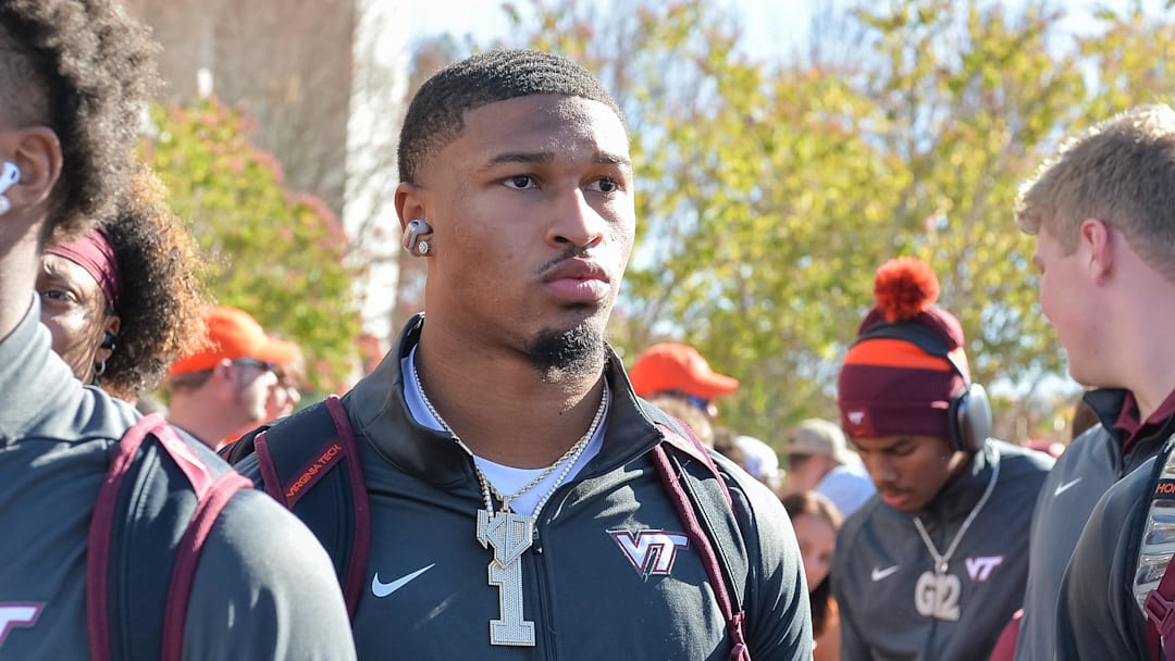 Nov 9, 2024; Blacksburg, Virginia, USA;  Virginia Tech Hokies quarterback Kyron Drones (1) as he walks into the stadium before the game against the Clemson Tigers at Lane Stadium. Mandatory Credit: Brian Bishop-Imagn Images