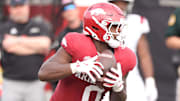 Arkansas Razorbacks running back Braylen Russell (0) rushes against the Arkansas State Red Wolves during the second quarter at War Memorial Stadium.