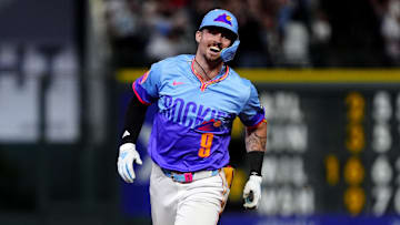 Aug 1, 2025; Denver, Colorado, USA; Colorado Rockies center fielder Brenton Doyle (9) celebrates his two run walk off home run in the ninth inning against the Pittsburgh Pirates at Coors Field. Mandatory Credit: Ron Chenoy-Imagn Images