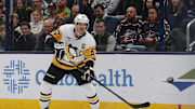 Nov 15, 2024; Columbus, Ohio, USA; Pittsburgh Penguins center Sidney Crosby (87) passes the puck against the Columbus Blue Jackets during the second period at Nationwide Arena. Mandatory Credit: Russell LaBounty-Imagn Images