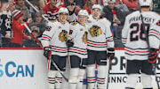 Nov 9, 2025; Detroit, Michigan, USA; Chicago Blackhawks center Connor Bedard (98) celebrates with defenseman Artyom Levshunov (55) and center Teuvo Teravainen (86) after scoring a goal in the first period at Little Caesars Arena. Mandatory Credit: Brian Bradshaw Sevald-Imagn Images