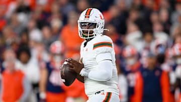 Nov 30, 2024; Syracuse, New York, USA; Miami Hurricanes quarterback Cam Ward (1) looks to pass against the Syracuse Orange during the first half at the JMA Wireless Dome. Mandatory Credit: Rich Barnes-Imagn Images