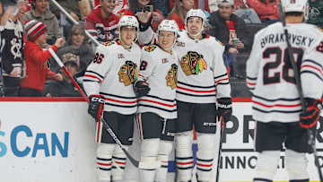 Nov 9, 2025; Detroit, Michigan, USA; Chicago Blackhawks center Connor Bedard (98) celebrates with defenseman Artyom Levshunov (55) and center Teuvo Teravainen (86) after scoring a goal in the first period at Little Caesars Arena. Mandatory Credit: Brian Bradshaw Sevald-Imagn Images
