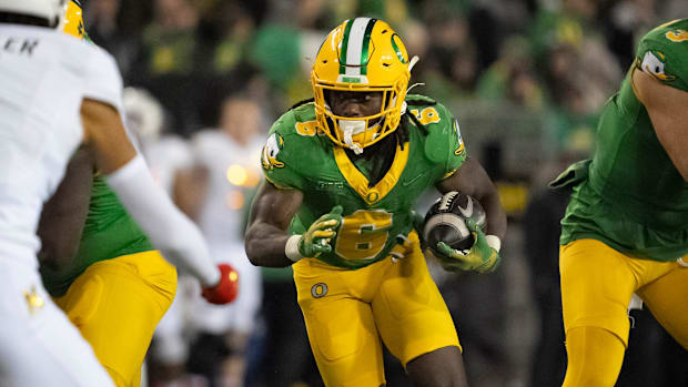 Oregon running back Noah Whittington carries the ball as the Oregon Ducks host the Maryland Terrapins at Autzen Stadium Satur