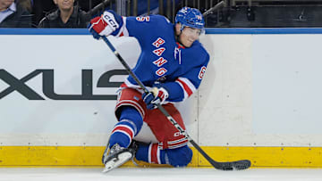 Sep 23, 2025; New York, New York, USA; New York Rangers left wing Brett Berard (65) plays the puck during the first period of a preseason game against the Boston Bruins at Madison Square Garden. Mandatory Credit: Vincent Carchietta-Imagn Images