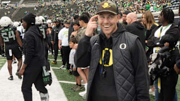 Oregon offensive coordinator Will Stein jokes on the sidelines during the Spring Game at Autzen Stadium.