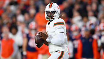 Nov 30, 2024; Syracuse, New York, USA; Miami Hurricanes quarterback Cam Ward (1) looks to pass against the Syracuse Orange during the first half at the JMA Wireless Dome. Mandatory Credit: Rich Barnes-Imagn Images