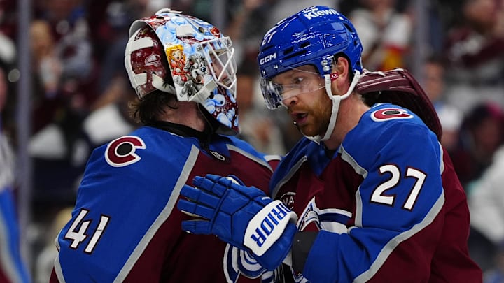 Apr 16, 2026; Denver, Colorado, USA; Colorado Avalanche goaltender Scott Wedgewood (41) and defenseman Brett Kulak (27) celebrate defeating the Seattle Kraken at Ball Arena. Mandatory Credit: Ron Chenoy-Imagn Images