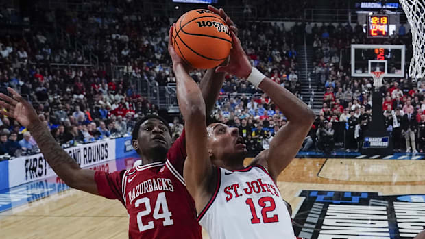 Arkansas Razorbacks forward Billy Richmond III (24) blocks a shot St. John's Red Storm guard RJ Luis Jr. (12) during 