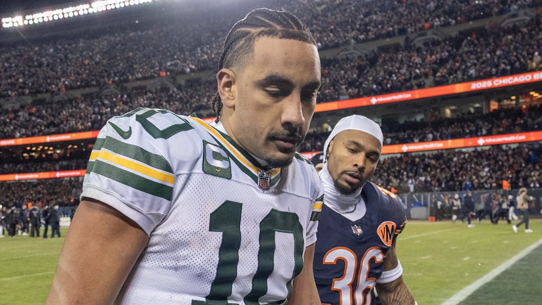 Green Bay Packers quarterback Jordan Love (10) walks off the field alongside former teammate Jonathan Owens on Saturday.