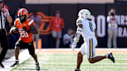 Baylor's Keaton Thomas (11) defends in the first half of the college football game between the Oklahoma State Cowboys and the Baylor Bears at Boone Pickens Stadium in Stillwater, Oklahoma