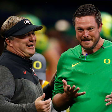 Georgia head coach Kirby Smart and Oregon head coach Dan Lanning meet during warm ups before the start of the Chick-fil-A Kickoff NCAA college football game between Oregon and Georgia in Atlanta, on Saturday, Sept. 3, 2022.

News Joshua L Jones