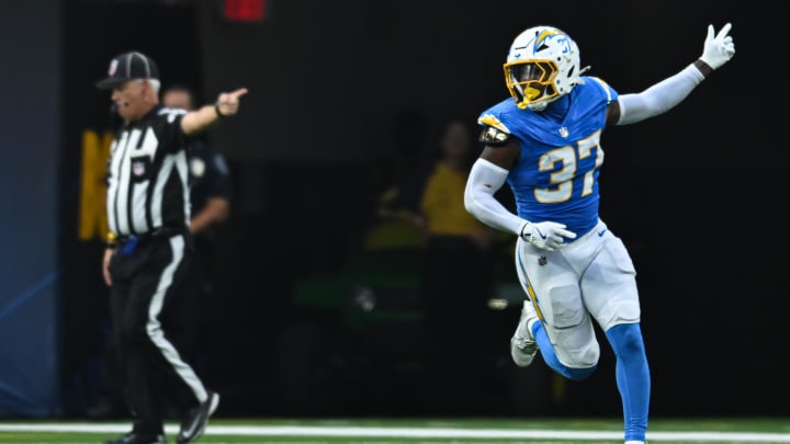 Aug 10, 2024; Inglewood, California, USA; Los Angeles Chargers safety Tony Jefferson (37) scores a touchdown against the Seattle Seahawks during the third quarter at SoFi Stadium. Mandatory Credit: Jonathan Hui-USA TODAY Sports