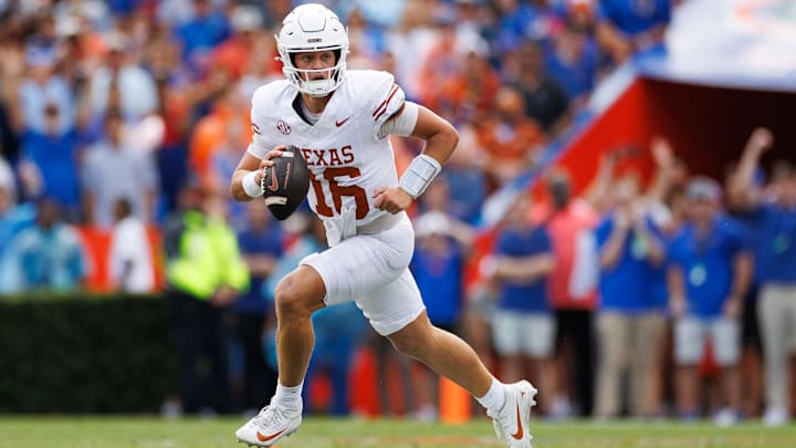Oct 4, 2025; Gainesville, Florida, USA; Texas Longhorns quarterback Arch Manning (16) scrambles with the ball against the Florida Gators during the first half at Ben Hill Griffin Stadium. Mandatory Credit: Matt Pendleton-Imagn Images