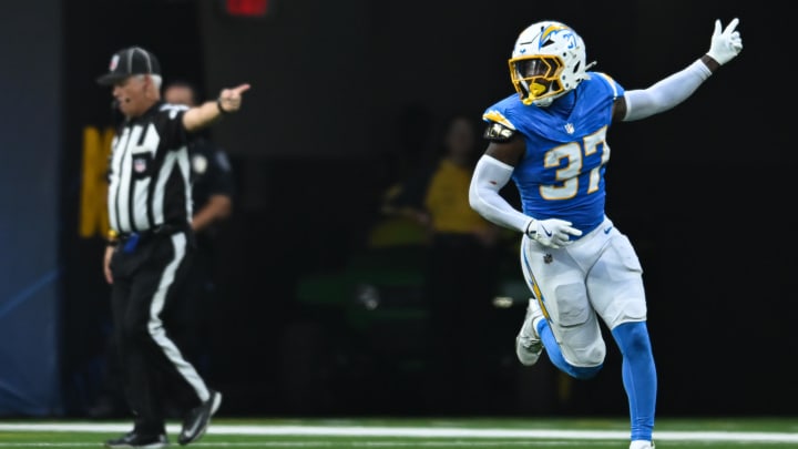 Aug 10, 2024; Inglewood, California, USA; Los Angeles Chargers safety Tony Jefferson (37) scores a touchdown against the Seattle Seahawks during the third quarter at SoFi Stadium. Mandatory Credit: Jonathan Hui-USA TODAY Sports