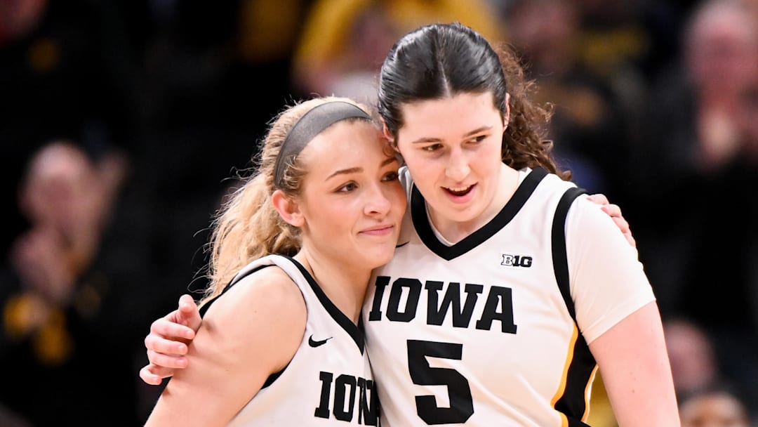 Mar 7, 2026; Indianapolis, IN, USA; Iowa Hawkeyes guard Kylie Feuerbach (4) and Iowa Hawkeyes center Ava Heiden (5) celebrate against the Michigan Wolverines during the second half at Gainbridge Fieldhouse. Mandatory Credit: Robert Goddin-Imagn Images