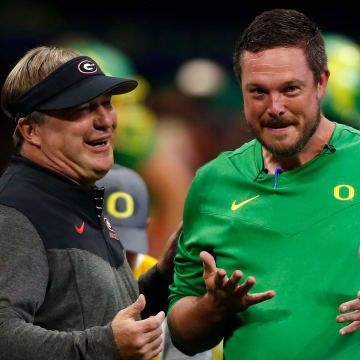 Georgia head coach Kirby Smart and Oregon head coach Dan Lanning meet during warm ups before the start of the Chick-fil-A Kickoff NCAA college football game between Oregon and Georgia in Atlanta, on Saturday, Sept. 3, 2022.

News Joshua L Jones