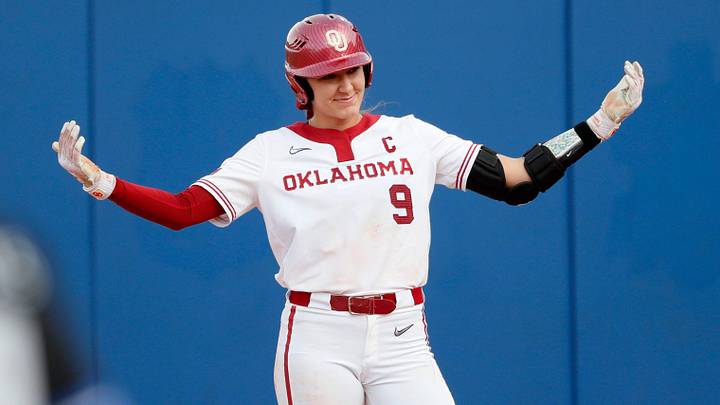 Oklahoma's Kinzie Hansen (9) celebrates a single of the Women's College World Series game between the University of Oklahoma Sooners and Duke at Devon Park in Oklahoma City, Thursday, May, 30, 2024.