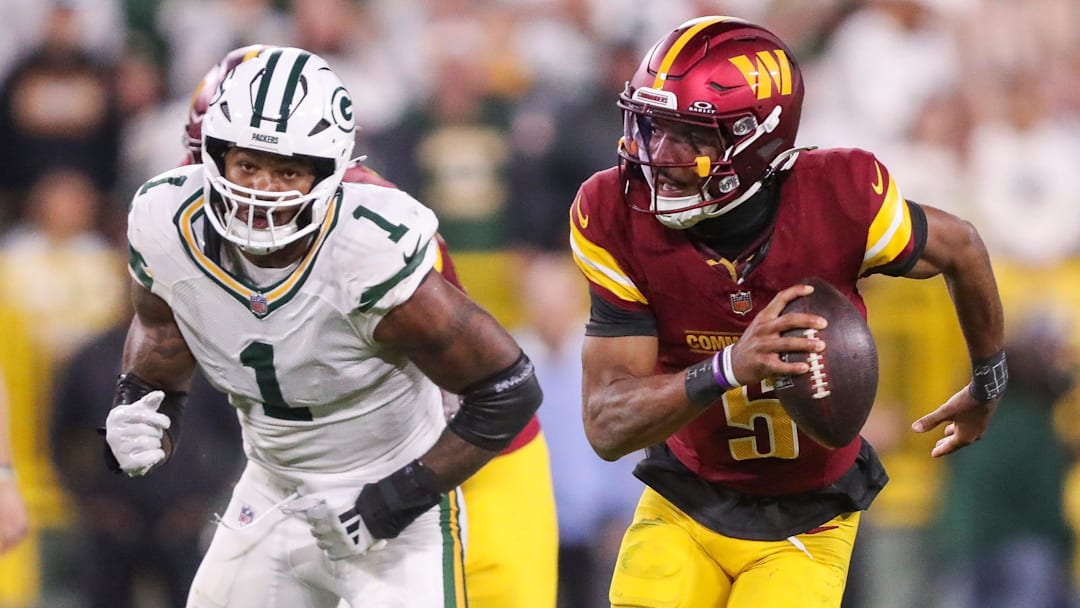 Washington Commanders quarterback Jayden Daniels (5) scrambles away from Green Bay Packers defensive end Micah Parsons (1) on Thursday, September 11, 2025, at Lambeau Field in Green Bay, Wis. The Packers won the game, 27-18.
Tork Mason/USA TODAY NETWORK-Wisconsin