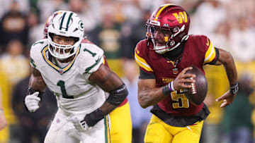 Washington Commanders quarterback Jayden Daniels (5) scrambles away from Green Bay Packers defensive end Micah Parsons (1) on Thursday, September 11, 2025, at Lambeau Field in Green Bay, Wis. The Packers won the game, 27-18.
Tork Mason/USA TODAY NETWORK-Wisconsin