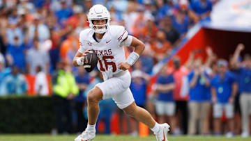 Oct 4, 2025; Gainesville, Florida, USA; Texas Longhorns quarterback Arch Manning (16) scrambles with the ball against the Florida Gators during the first half at Ben Hill Griffin Stadium. Mandatory Credit: Matt Pendleton-Imagn Images