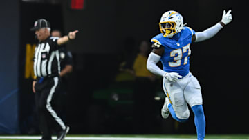 Aug 10, 2024; Inglewood, California, USA; Los Angeles Chargers safety Tony Jefferson (37) scores a touchdown against the Seattle Seahawks during the third quarter at SoFi Stadium. Mandatory Credit: Jonathan Hui-Imagn Images