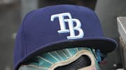 Sep 26, 2025; Toronto, Ontario, CAN; The hat and glove of Tampa Bay Rays third baseman Junior Caminero (13) in the dugout during the game against the Toronto Blue Jays at Rogers Centre. 