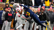 Ohio State Buckeyes wide receiver Carnell Tate (17) attempts to catch a pass against Michigan Wolverines defensive back Zeke Berry (10) in the first half of the NCAA football game at Michigan Stadium on Saturday, Nov. 29, 2025 in Ann Arbor, Michigan.