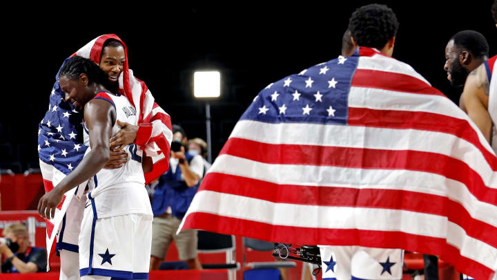 Aug 7, 2021; Saitama, Japan; United States forward Kevin Durant (7) and United States guard Jrue Holiday (12) celebrate winning the gold medal against France in the men's basketball gold medal game during the Tokyo 2020 Olympic Summer Games at Saitama Super Arena. Mandatory Credit: Geoff Burke-USA TODAY Sports