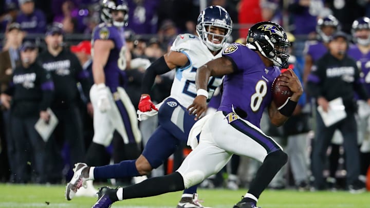 Jan 11, 2020; Baltimore, Maryland, USA; Baltimore Ravens quarterback Lamar Jackson (8) runs with the ball as Tennessee Titans cornerback Logan Ryan (26) chases in a AFC Divisional Round playoff football game at M&T Bank Stadium. Mandatory Credit: Geoff Burke-Imagn Images