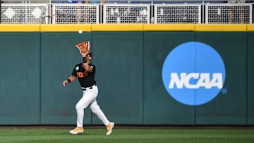 Tennessee's Hunter Ensley (9) makes a catch in the outfield during game three of the NCAA College World Series finals between Tennessee and Texas A&M at Charles Schwab Field in Omaha, Neb., on Monday, June 24, 2024. Baseball is a sport that will be heavily affected by roster limits.