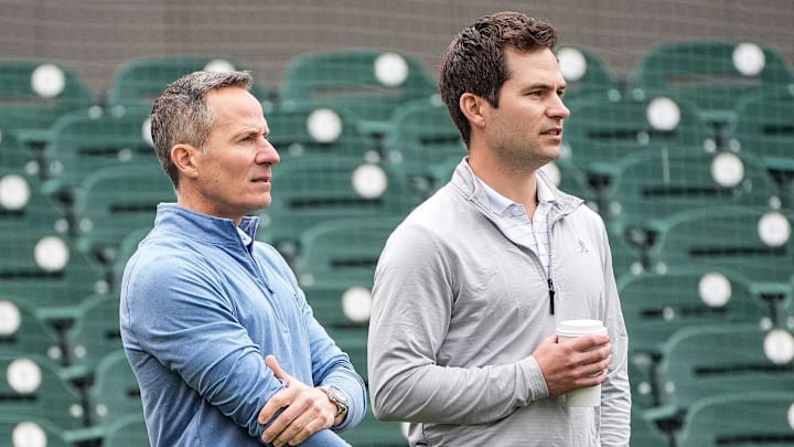 Detroit Tigers team owner Chris Ilitch, left, talks to president of baseball operation Scott Harris as they watch batting practice during spring training at Joker Marchant Stadium in Lakeland, Fla. on Thursday, Feb. 20, 2025.