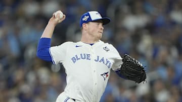 Toronto Blue Jays pitcher Louis Varland (77) pitches in the eighth inning against the Los Angeles Dodgers during game two of the 2025 MLB World Series at Rogers Centre. 