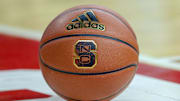 Feb 20, 2019; Raleigh, NC, USA; Basketball with the North Carolina State Wolfpack logo sits on the court during a timeout as the Wolfpack play the Boston College Eagles in the first half at PNC Arena. The North Carolina State Wolfpack won 89-80. Mandatory Credit: Nell Redmond-Imagn Images