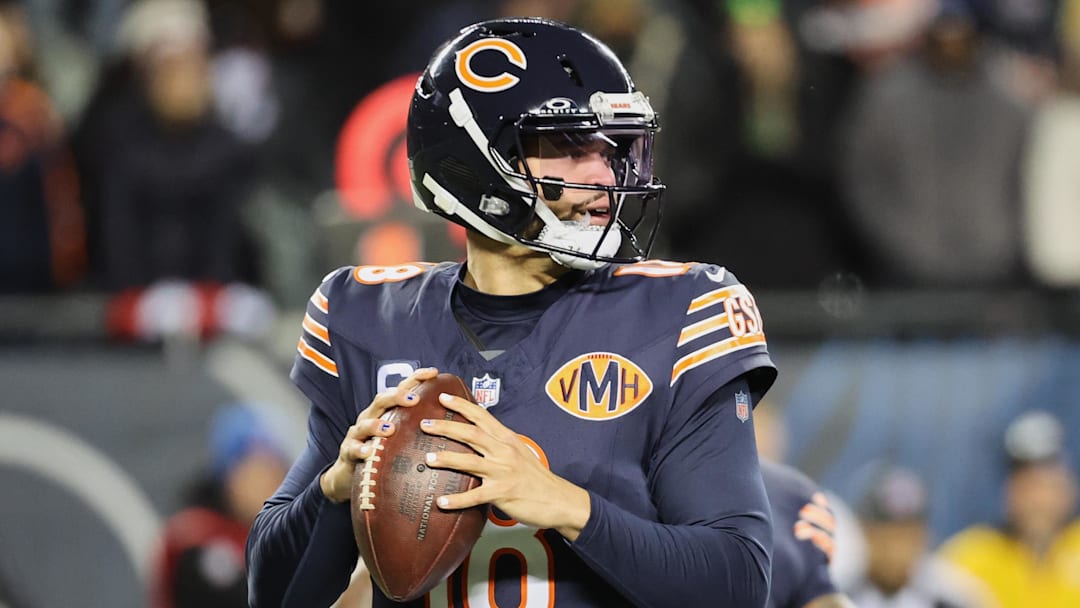 Dec 20, 2025; Chicago, Illinois, USA; Chicago Bears quarterback Caleb Williams (18) looks to throw a pass against the Green Bay Packers during the first quarter at Soldier Field. Mandatory Credit: Mike Dinovo-Imagn Images