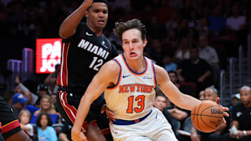 Oct 26, 2025; Miami, Florida, USA; New York Knicks guard Tyler Kolek (13) drives to the basket against Miami Heat guard Dru Smith (12) and center Bam Adebayo (13) during the third quarter at Kaseya Center. Mandatory Credit: Sam Navarro-Imagn Images