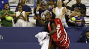 Venus Williams waves to the crowd after winning a match at the Citi Open, her return to tennis after a year away from the court.