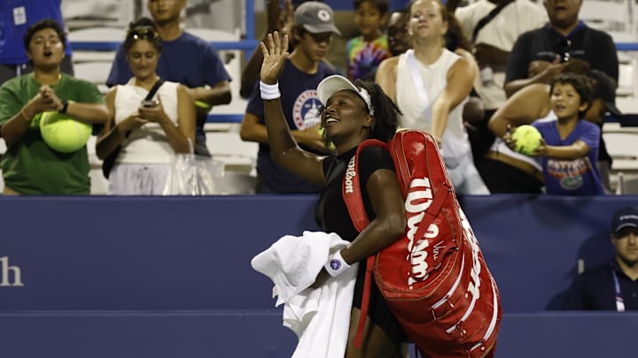 Venus Williams waves to the crowd after winning a match at the Citi Open, her return to tennis after a year away from the court.