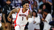 Nov 22, 2024; Tucson, Arizona, USA; Arizona Wildcats guard Caleb Love (1) smiles after a three pointer was made during the first half against the Duke Blue Devils at McKale Center.