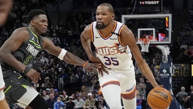 Phoenix Suns forward Kevin Durant (35) brings the ball up as Minnesota Timberwolves guard Anthony Edwards
